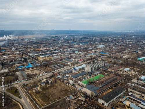 Aerial view from drone of industrial zone with fuming chimneys. Chemical plant