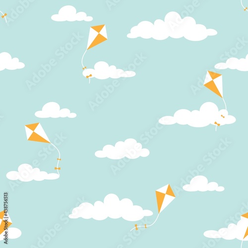 Cute seamless ornament with white clouds and kites on powder blue background.