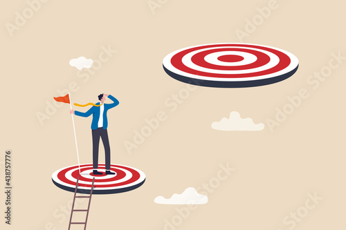 Challenge achievement or higher target, the way forward or next level, bigger business goal or aspiration concept, success businessman climb up ladder reaching goal and looking for next bigger step. photo