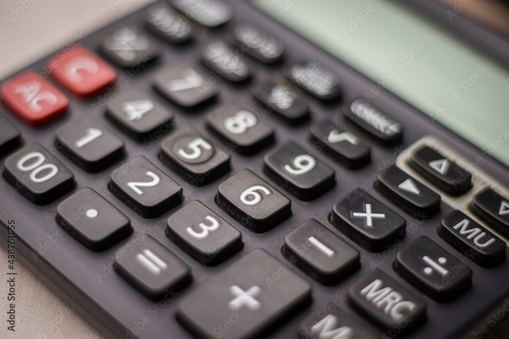 Black calculator on white background isolated stock image. Black calculator on white background isolated stock image.