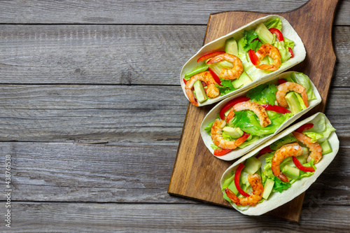 Tacos with shrimp, avocado and salad. Mexican food. © Vladislav Chusov