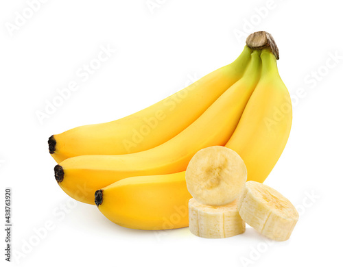 Delicious ripe bananas and pieces on white background