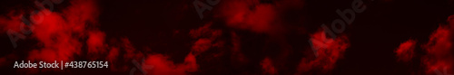 Red clouds in the black sky. Surreal background with copy space for text, design. Wide banner. Fantastic mystical night sky. Website header.