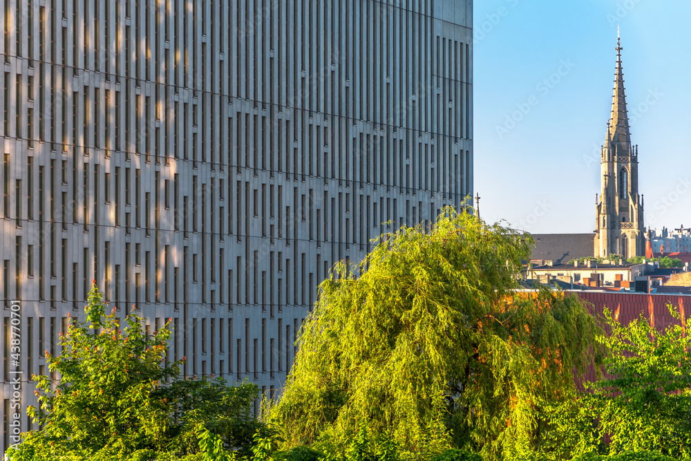 Katowice, Silesia, Poland; June 4, 2021: Close-up on the office building in modern business center against city scape