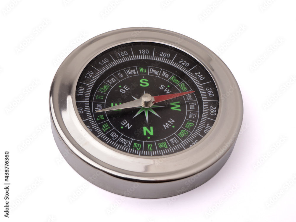 Magnetic silver metal compass on white background Magnetic silver metal compass on white background