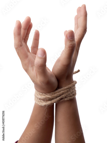 Person hands tied with rope isolated on white background, captive victim restrained photo
