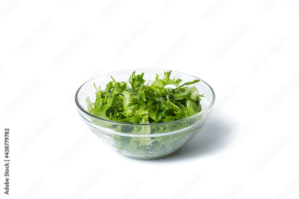 Fresh arugula in a plate. Vegan food concept. transparent plate with arugula. isolated on white. Fresh arugula in a plate. Vegan food concept. transparent plate with arugula. isolated on white.