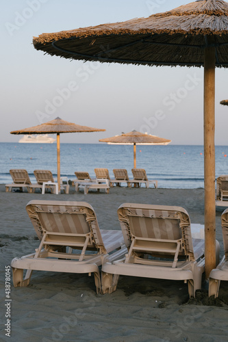 Empty sans beach with umbrellas  nobody because of virus  tourism crisis