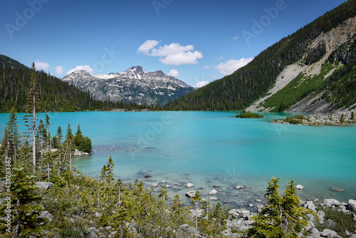 A beautiful glacial lake in Canada. The turquoise Joffre Lake is surrounded by the Rainforest. Mountain peaks in the background. Joffre Lakes Provincial Park. British Columbia  Canada.
