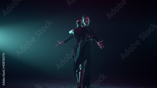 Professional dance couple taking part competition. Ballroom dancers performing