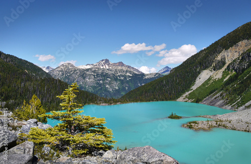 A beautiful glacial lake in Canada. The turquoise Joffre Lake is surrounded by the Rainforest. Mountain peaks in the background. Joffre Lakes Provincial Park. British Columbia, Canada.