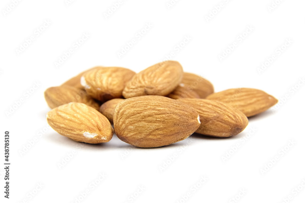 Almond nuts isolated on white background. Heap of peeled almonds Almond nuts isolated on white background. Heap of peeled almonds