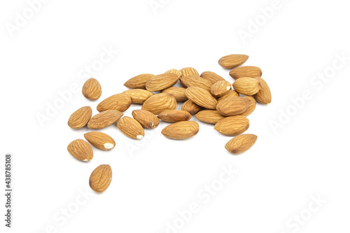 Almond nuts isolated on white background. Heap of scattered almonds