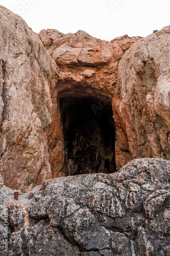 Cave in the rocks on the shore