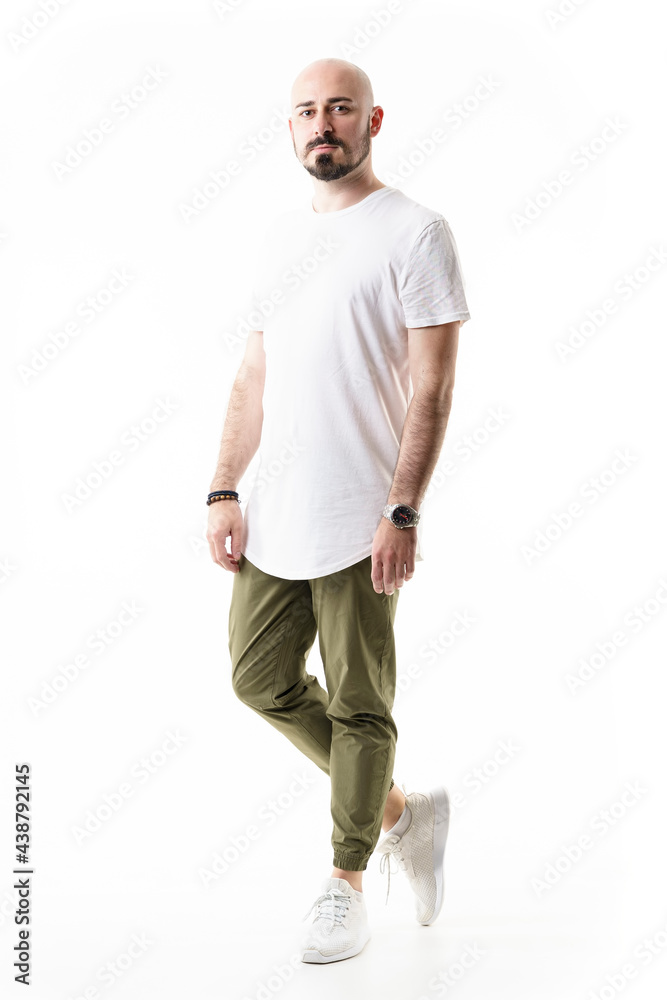 Fototapeta premium Shaved bald bearded young man in casual stylish clothes looking at camera. Full body length isolated on white background