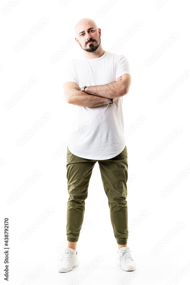 Proud confident stylish bald man in white shirt and olive green trousers standing. Full body length isolated on white background