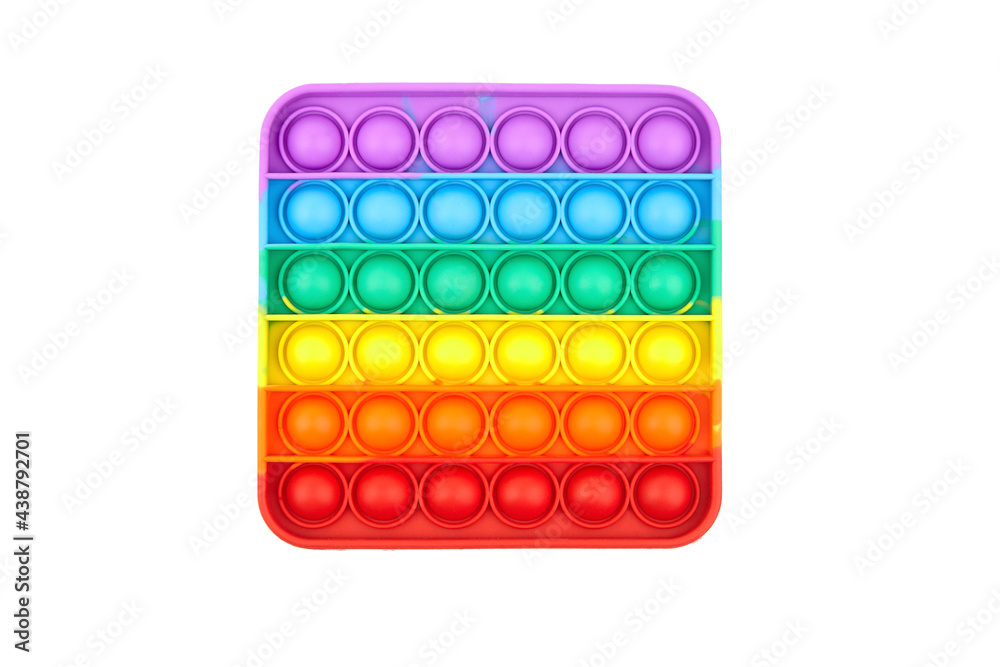 Pop it fidget toy isolated on white background, top view. Rainbow square anti stress fidget Pop it fidget toy isolated on white background, top view. Rainbow square anti stress fidget