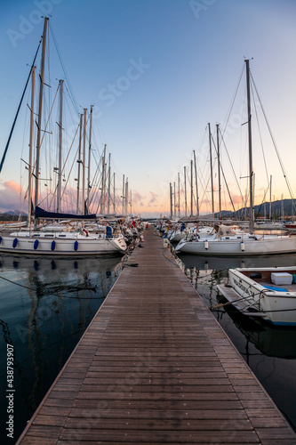 Marina yacht club on the European island of Sardinia at sunset
