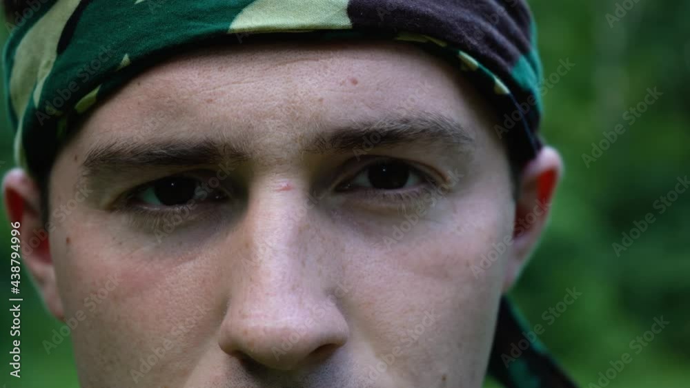 face of a man standing in the woods close-up face of a man standing in the woods close-up