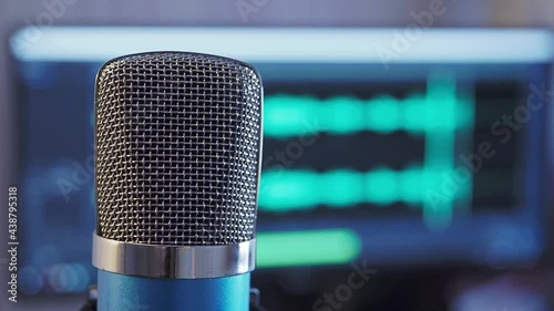 Close-up microphone with waveform in the background