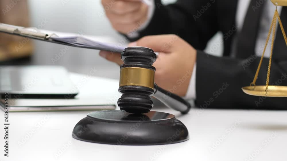 Consult Judge or lawyer Hand Writing Document in Court Room. Consult Judge or lawyer Hand Writing Document in Court Room.