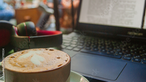 Working hours with a great coffee in the middle of the day. A background with a cafe photo