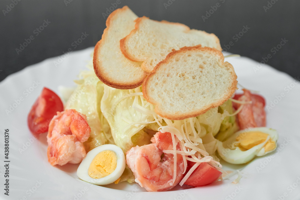 Gourmet caesar salad with shrimps and croutons. Gourmet caesar salad with shrimps and croutons.