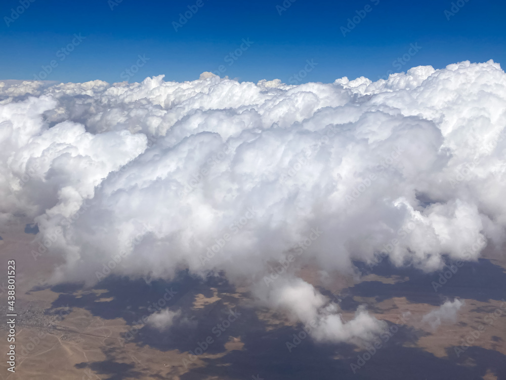 sky, clouds, cloud, blue, nature, view, aerial, white, air, high, fly, heaven, landscape, flight, cloudscape, cloudy, atmosphere, weather, horizon, space, above, mountain, day, sun, earth