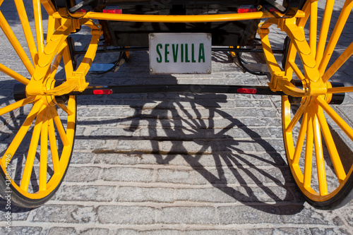 Traditional Horse drawn carriage with Seville license plaque, Spain photo