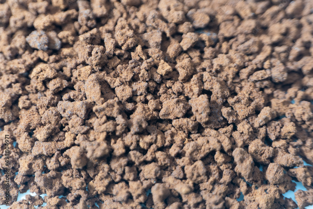 Instant coffee powder on white background with selective focus Instant coffee powder on white background with selective focus