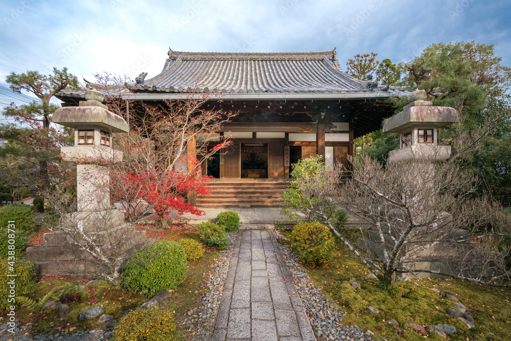Ancient, small Buddhist shrine with stone lamps and small Japanese garden in front of it in Arashiyama district of Kyoto, Japan. Ancient, small Buddhist shrine with stone lamps and small Japanese garden in front of it in Arashiyama district of Kyoto, Japan.