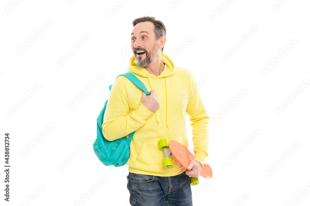 male casual hipster style. mature happy man carry backpack and penny board. surprised senior guy male casual hipster style. mature happy man carry backpack and penny board. surprised senior guy