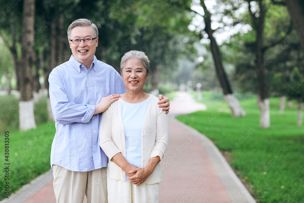 Happy old couple walking in the park Happy old couple walking in the park