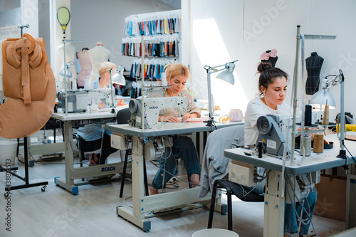 Photography Russia Moscow 5 June 2021 Woman dressmaker, seamstress, modiste tailor working a