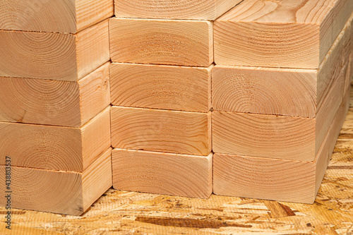 Closeup of construction lumber boards. Building materials price increase, home construction and remodeling cost concept. photo
