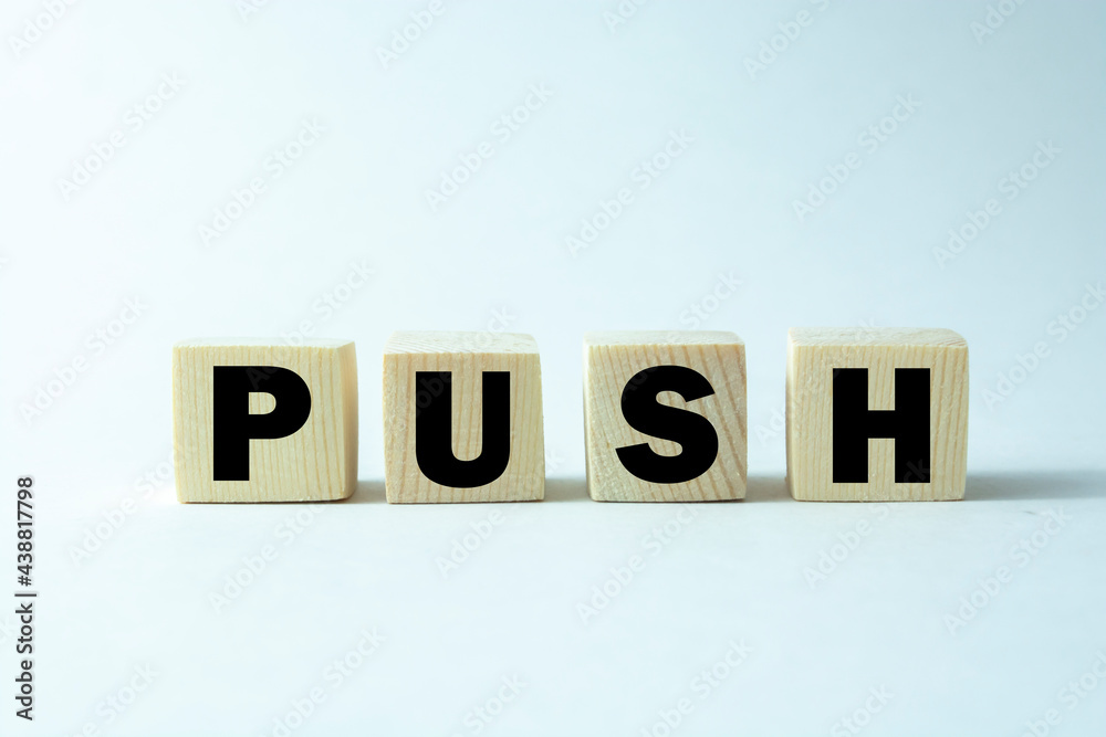 Time to push. Wooden block form the word 'push' on beautiful white background. Business and push concept. Copy space. Time to push. Wooden block form the word 'push' on beautiful white background. Business and push concept. Copy space.