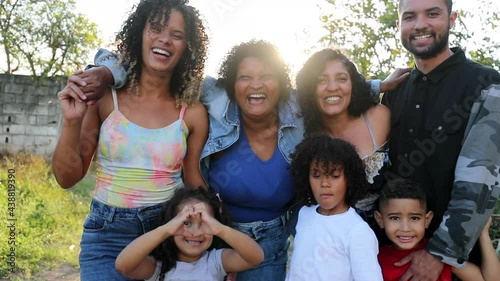 Happy casual hispanic family posing outside. South American latin parents and children