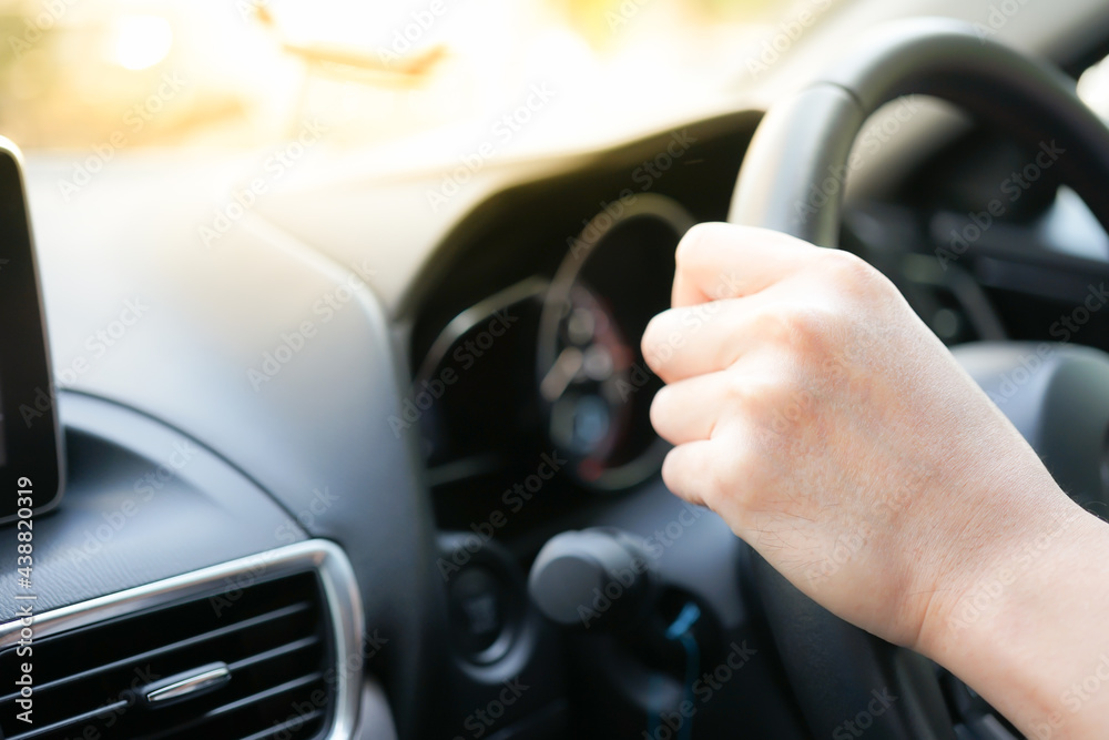 Close up of the hands of a man driver driving a luxury car chauffeur car driver service car sharing Taxi driver home delivery background concept