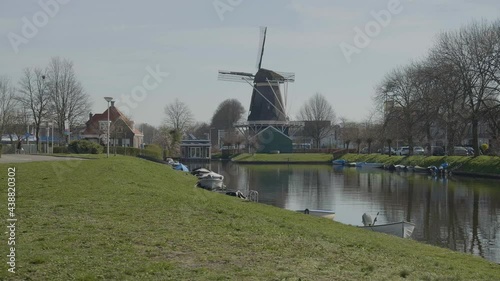 Oliemolen De Passiebloem windmill by canal in Zwolle’s historic city center photo