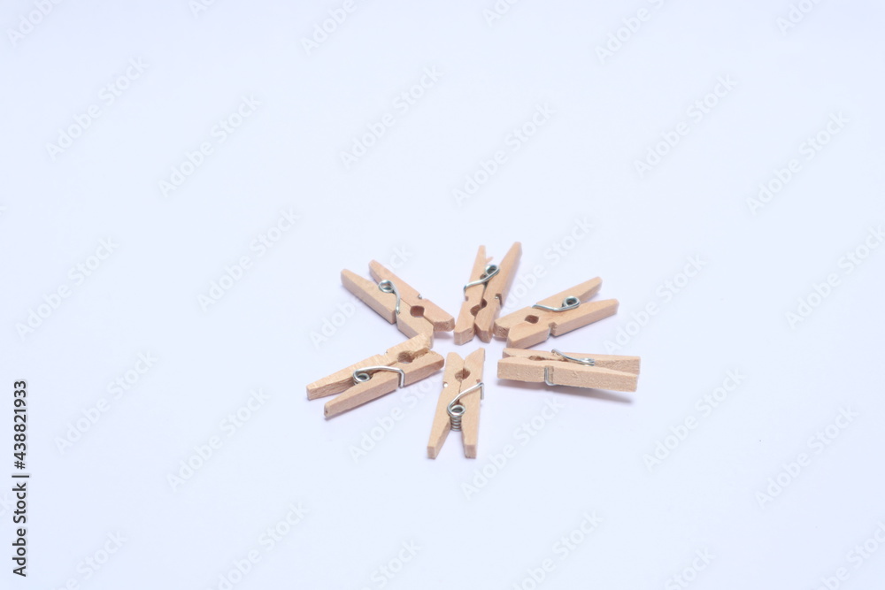 Wooden clips on a white background Wooden clips on a white background