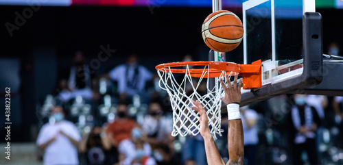 basketball going through the hoop at a sports arena © Melinda Nagy