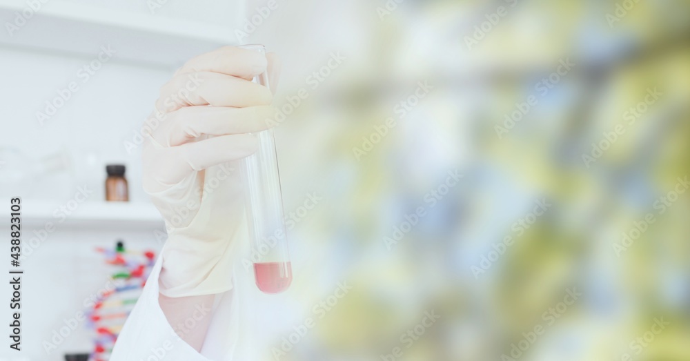Obraz premium Composition of scientist holding test tube in laboratory with copy space