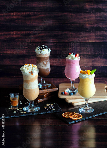 FRAPPES and SMOOTHIES in a tall glass with syrup and whipped cream, Refreshing and healthy drink