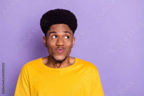 Portrait of attractive minded cheerful guy overthinking copy empty space isolated over violet purple color background