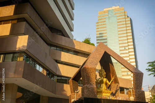 Office building in Bangkok's business center with a Buddha image