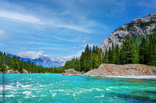 Bow River in Banff National Park With Canadian Rockies in Background