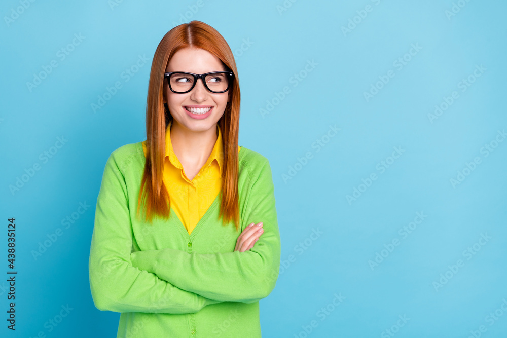 Portrait of attractive cheerful red-haired girl folded arms thinking copy space isolated over bright blue color background Portrait of attractive cheerful red-haired girl folded arms thinking copy space isolated over bright blue color background