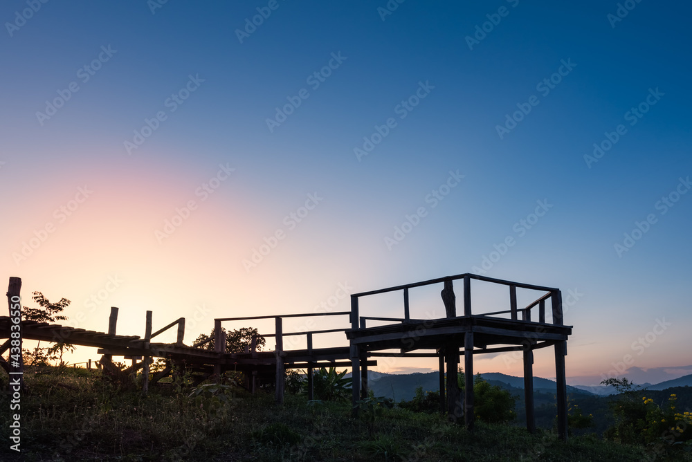 silhouette of the wooden bridge on beautiful sunset