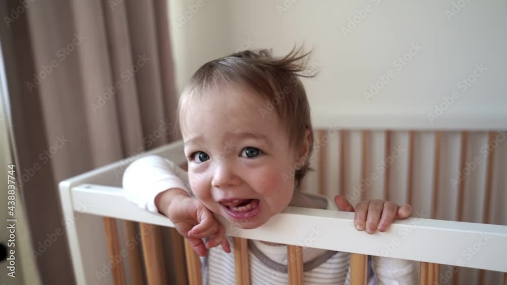 baby in the crib at the morning baby in the crib at the morning