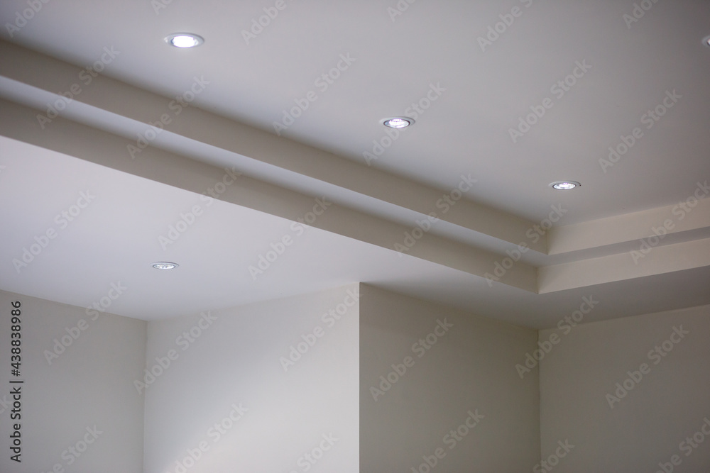 The walls and ceiling have just been painted white. Construction work of a bricklayer in Thailand. Background image